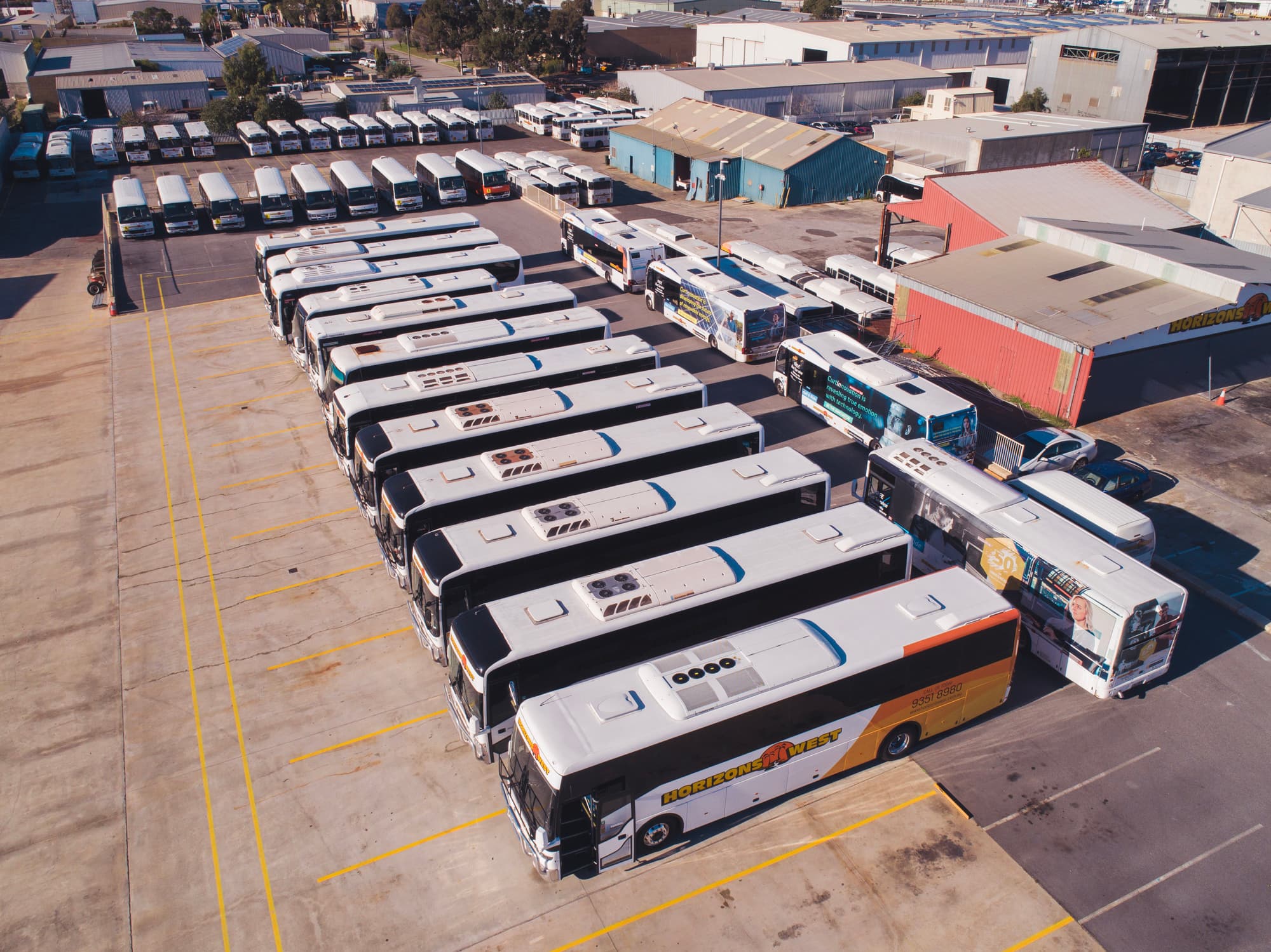 Horizons West coaches parked in rows at the depot, seen from above