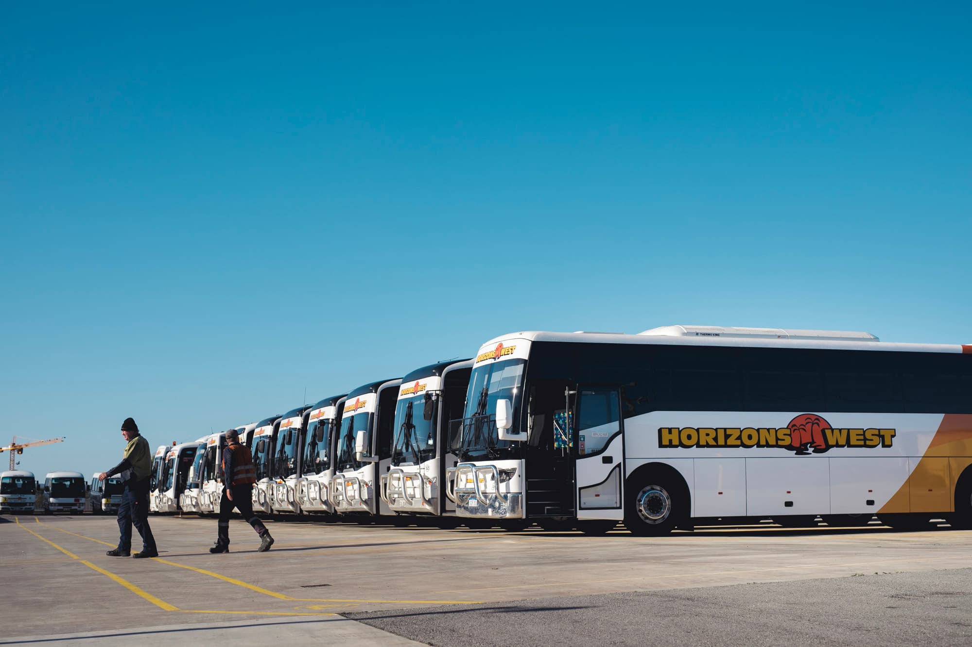 Horizons West staff alongside coaches at the depot