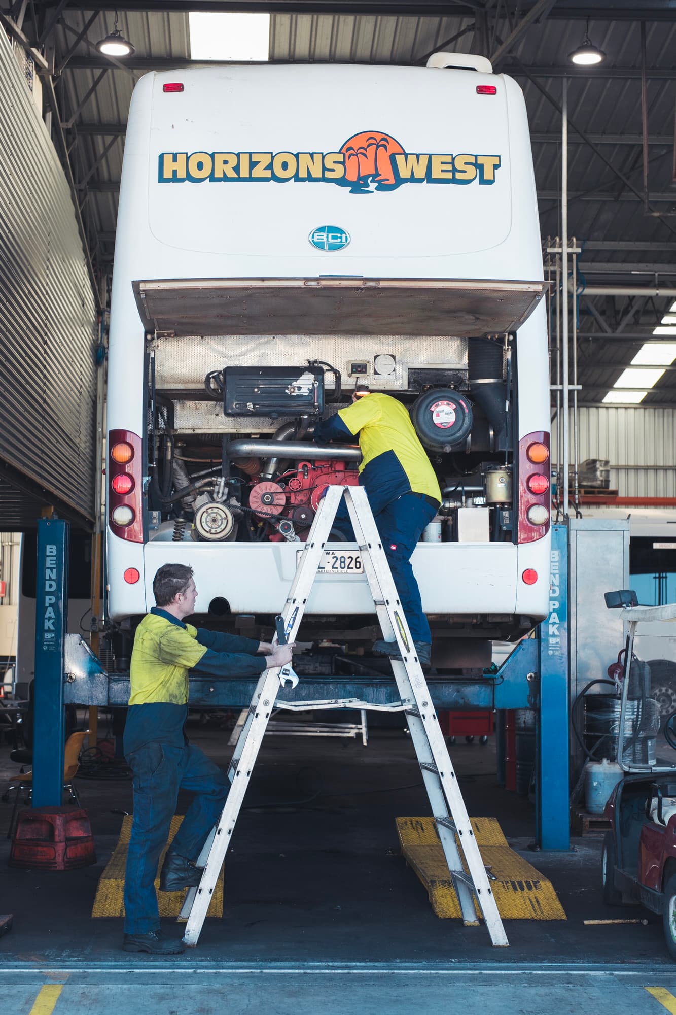 Horizons West mechanics servicing a coach engine