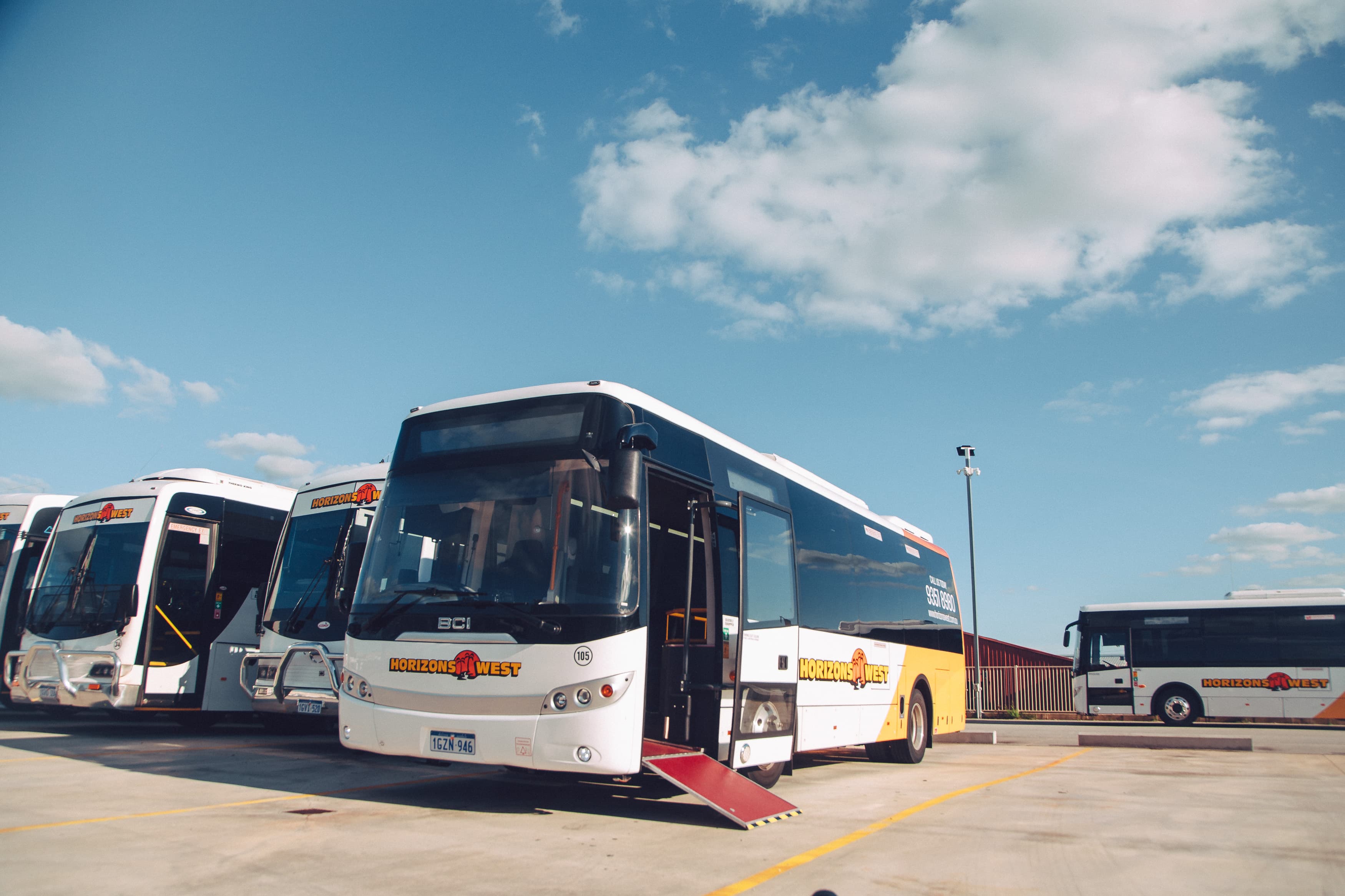 Wheelchair ramp extended at the door of a Horizons West coach